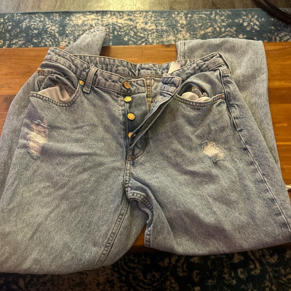 H and M blue denim jeans with rips on knees